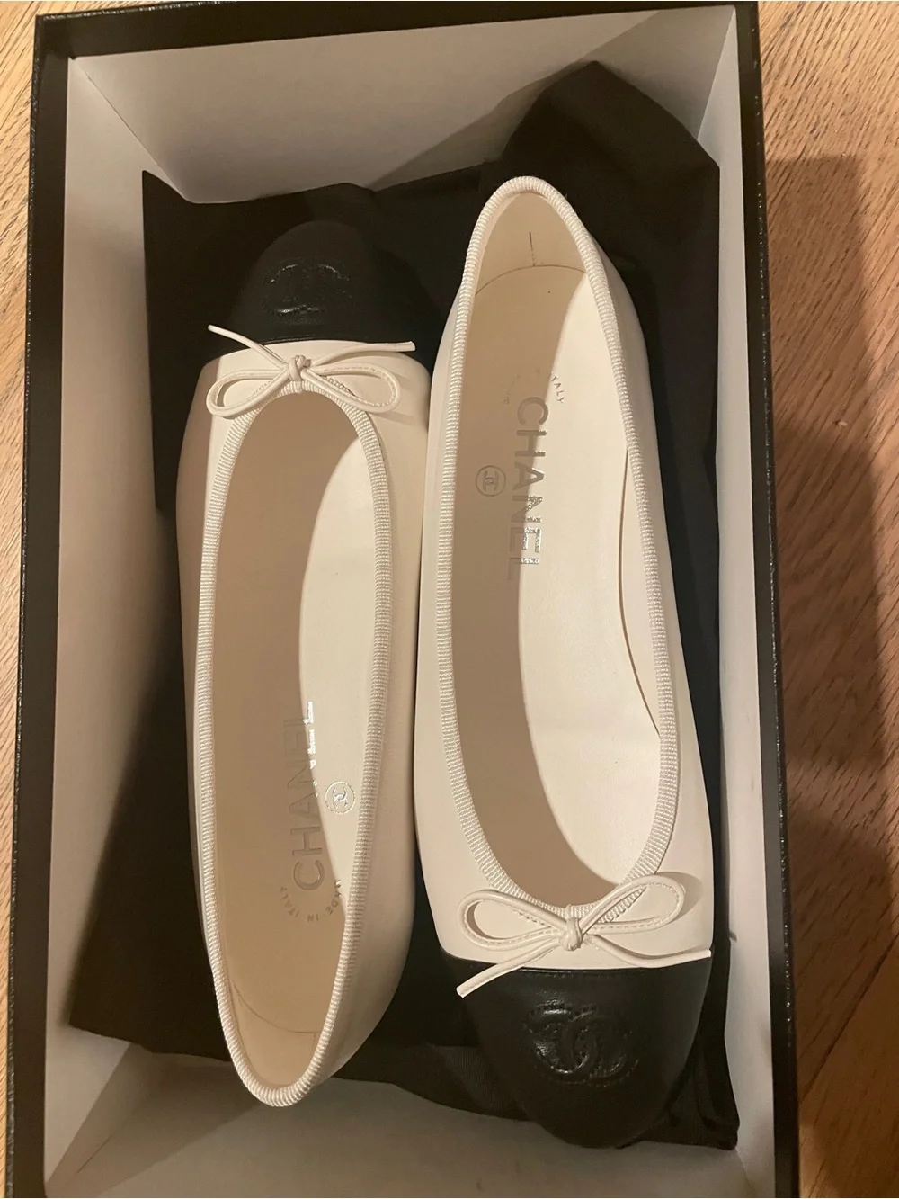 CHANEL Two-Tone Leather Cap-Toe Ballet Flats in Cream and Black